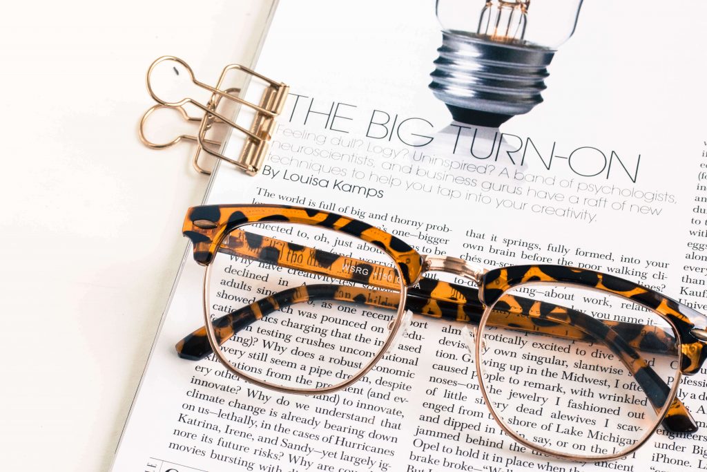 glasses with book and paper clip